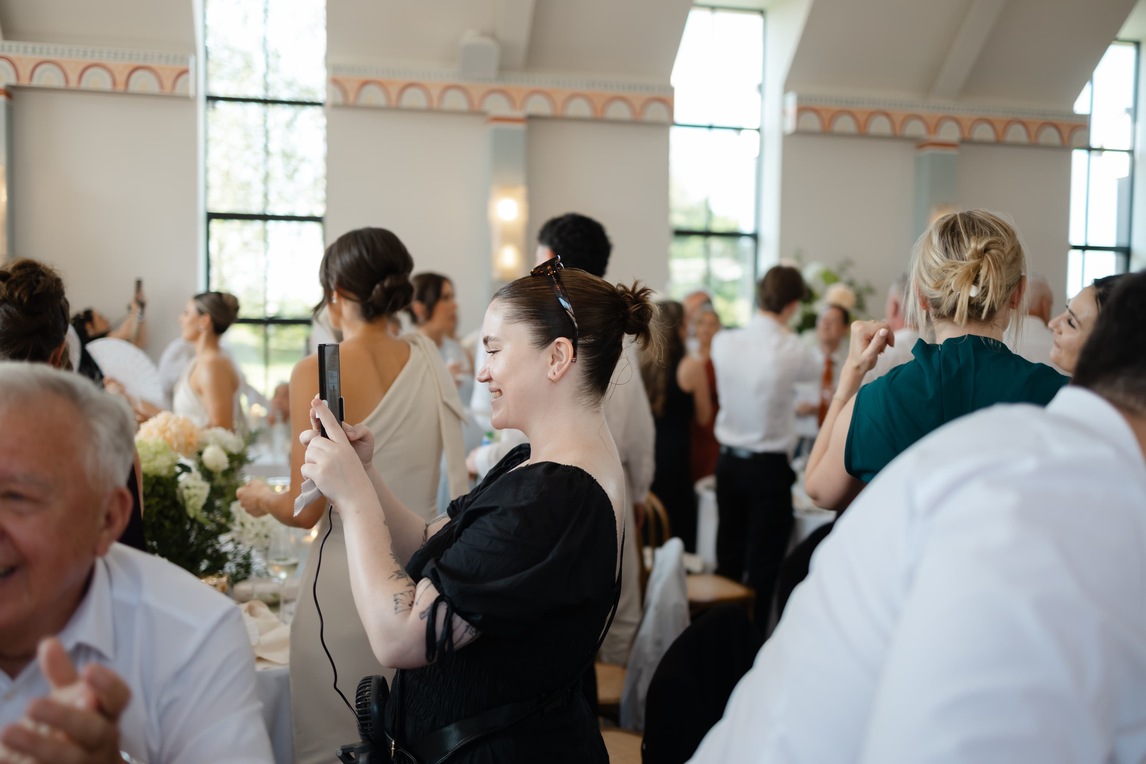 Behind-the-scenes wedding content creator capturing candid moments